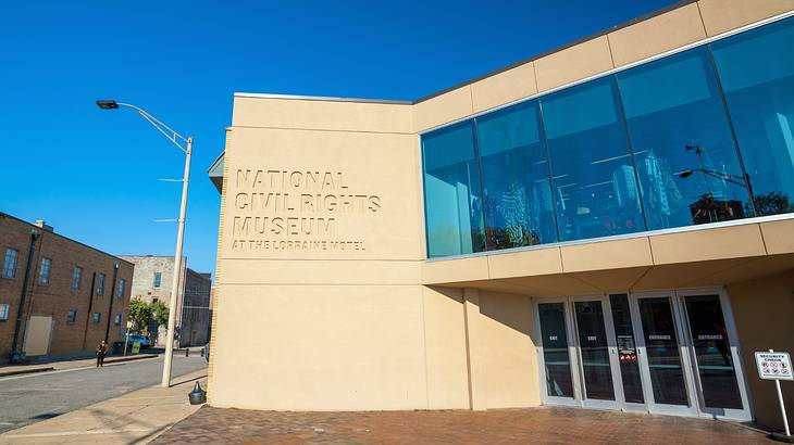 A museum building with a sign that says "National Civil Rights Museum" A museum building with a sign that says "National Civil Rights Museum"