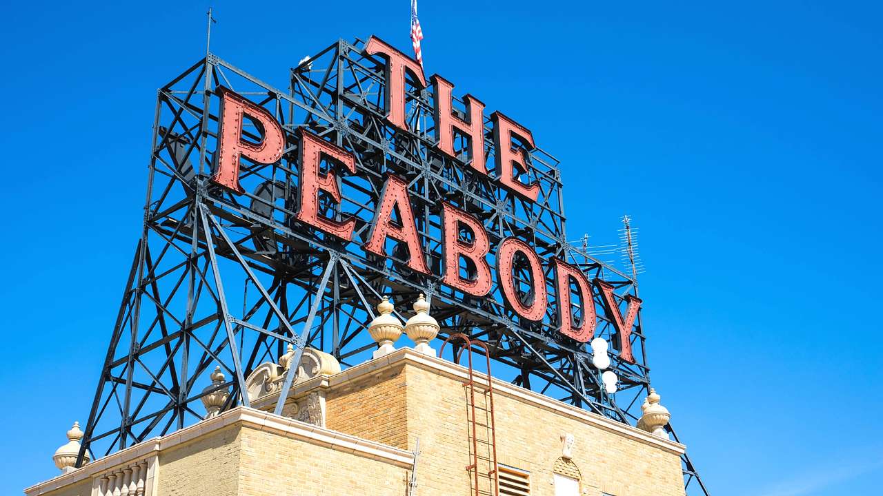 A brick building with a large sign that says "The Peabody"