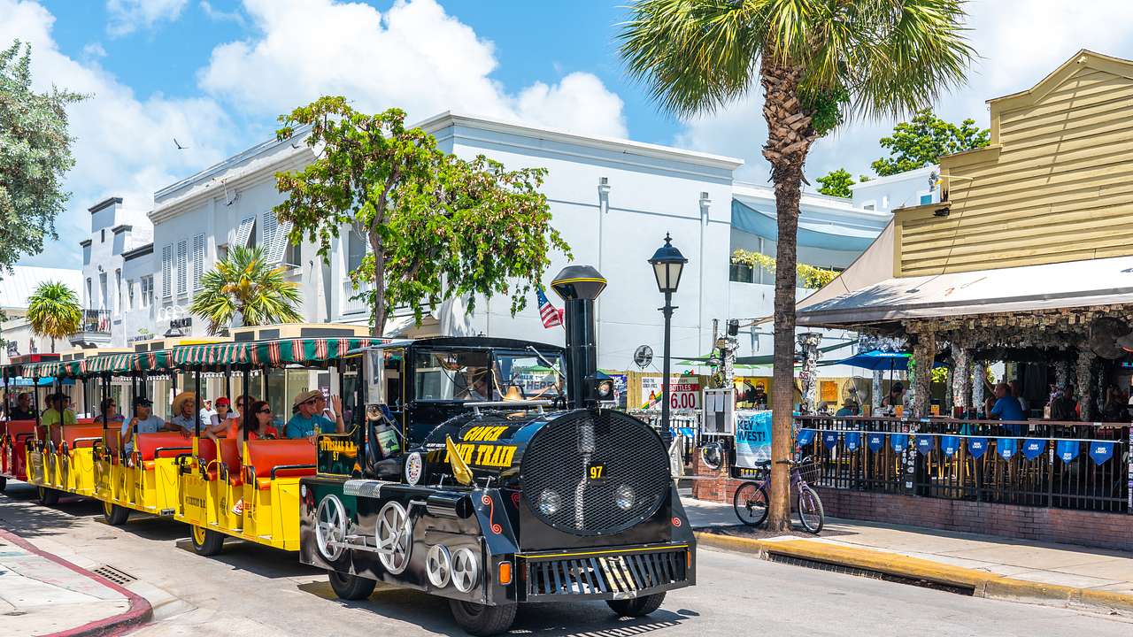 End your long weekend in Key West itinerary is by riding a Conch Tour Train
