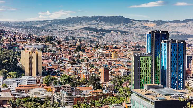 A cityscape with mountain ranges in the background