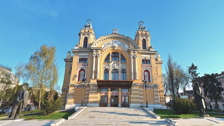 A view of a yellow theatre building and blue sky, Cluj-Napoca, Romania