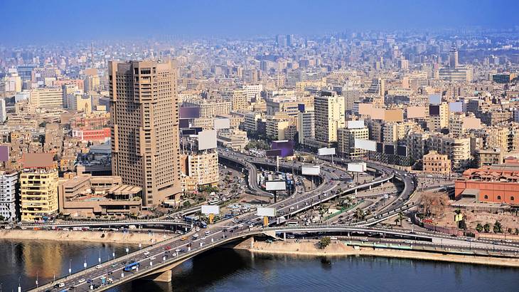 Aerial shot of a bustling city near a body of water