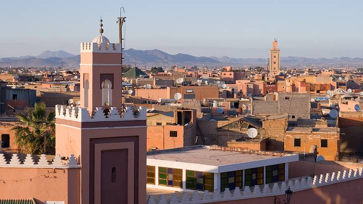 Moorish-style structures in the city under a cloudy sky