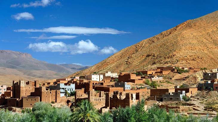 A village of houses at the foot of a mountain