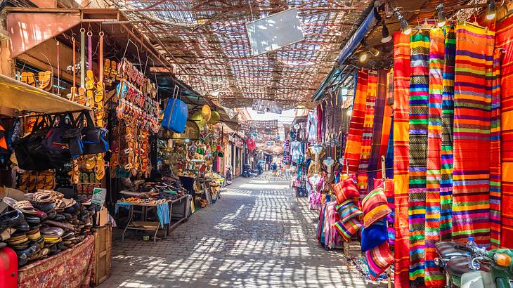 Empty alley with adjacent souks selling colorful items
