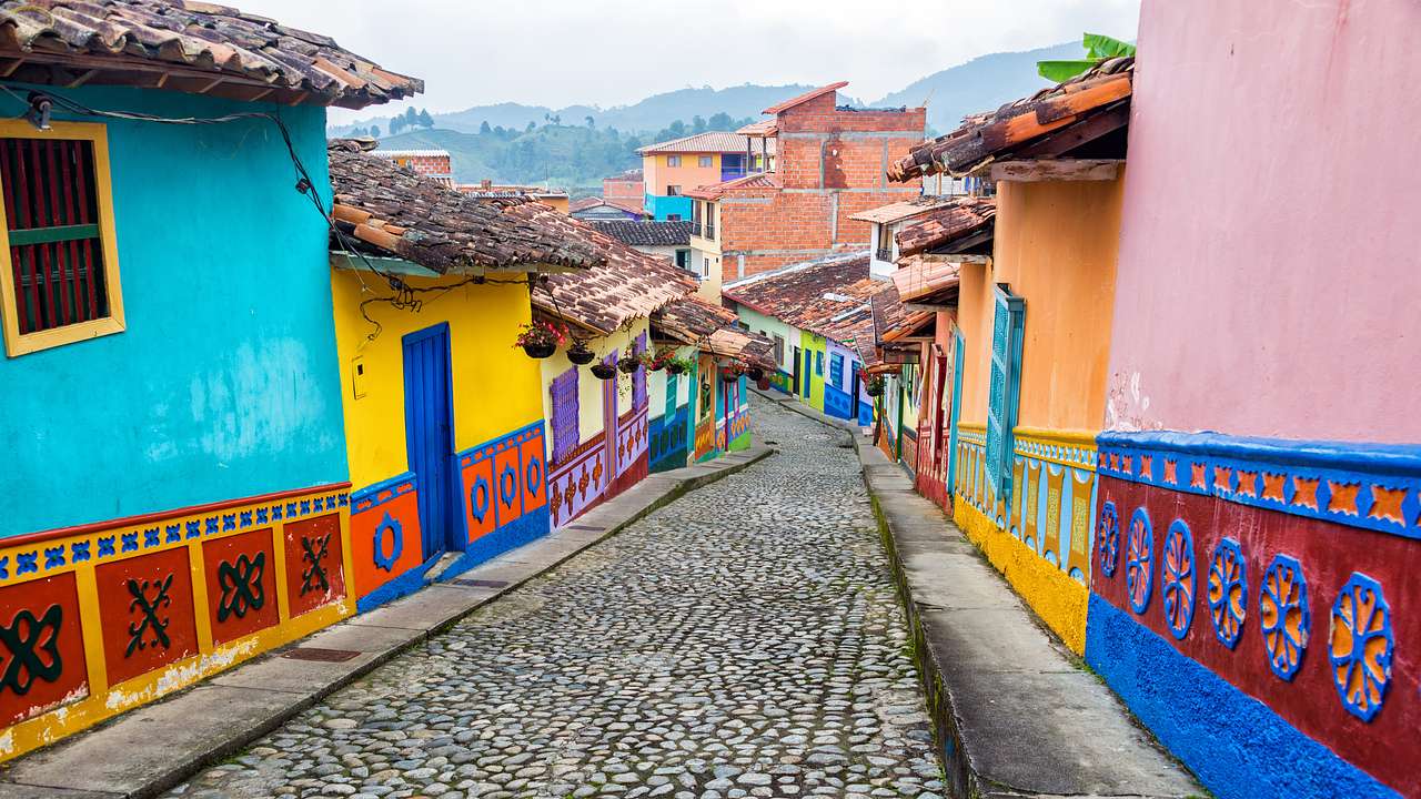 Colorful houses by a cobblestone street