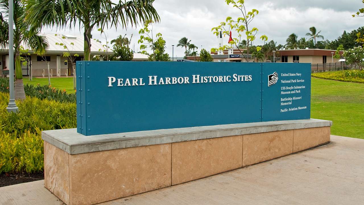 Signage on a stone platform that reads "Pearl Harbor Historic Sites"