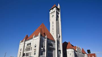 A Romanesque Revival-style building with a tall tower
