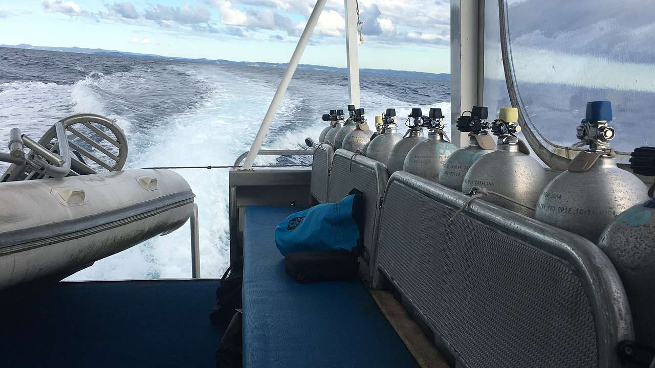 Scuba diving gear on a boat on the water