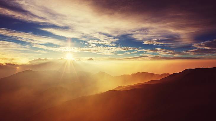 An orange sunset over mountains