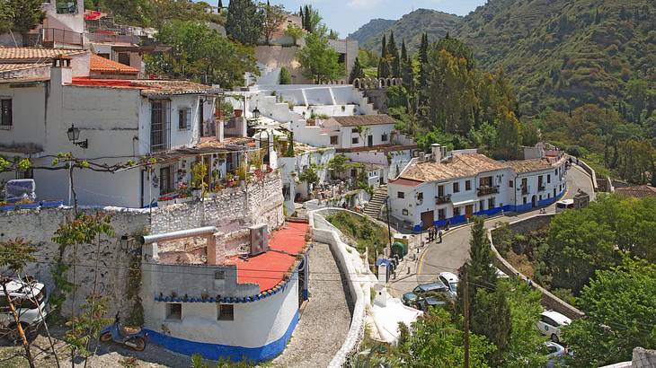 White houses and roads on a hilly terrain