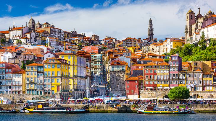 Colorful houses on a hilly terrain near a body of water