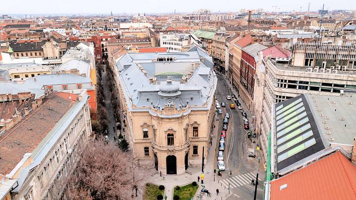 Aerial shot of an old corner building near other buildings