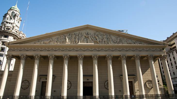 Facade of an old church with 12 columns and religious symbols as exterior designs