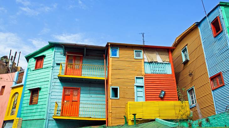 Colorful houses painted in orange, yellow, blue, green and turquoise