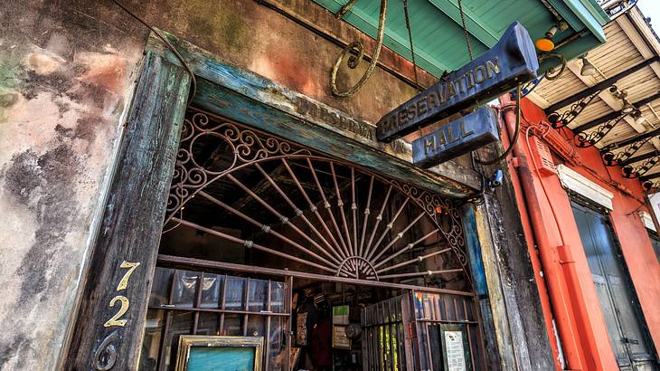 An old door frame with a Preservation Hall sign