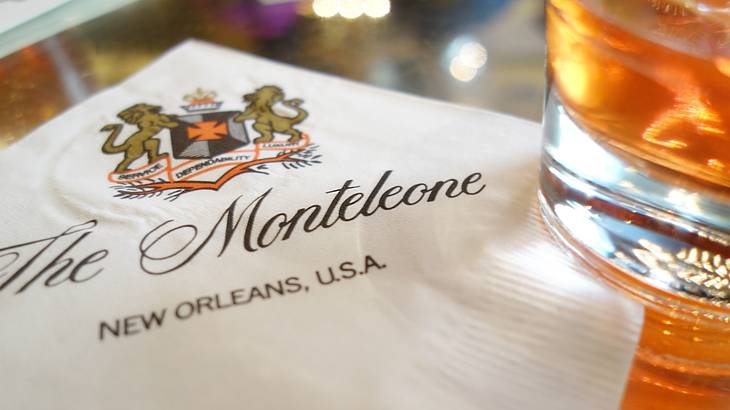 A napkin that says The Monteleone with a glass of liquor beside it