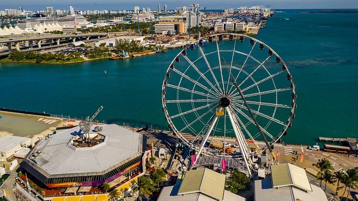 Aerial of structures along a beach with an observation wheel