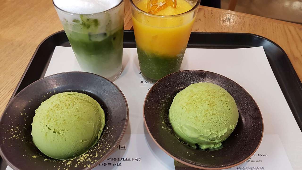 Two iced teas and two round scoops of green tea ice cream from above