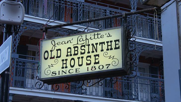A signboard that reads "Jean Lafitte's Old Absinthe House since 1807"