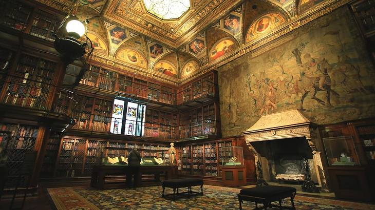 An old-fashioned library with a fireplace and bookcases