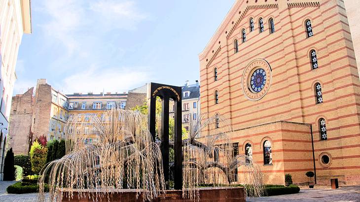 A facade of a church with an art installation in front