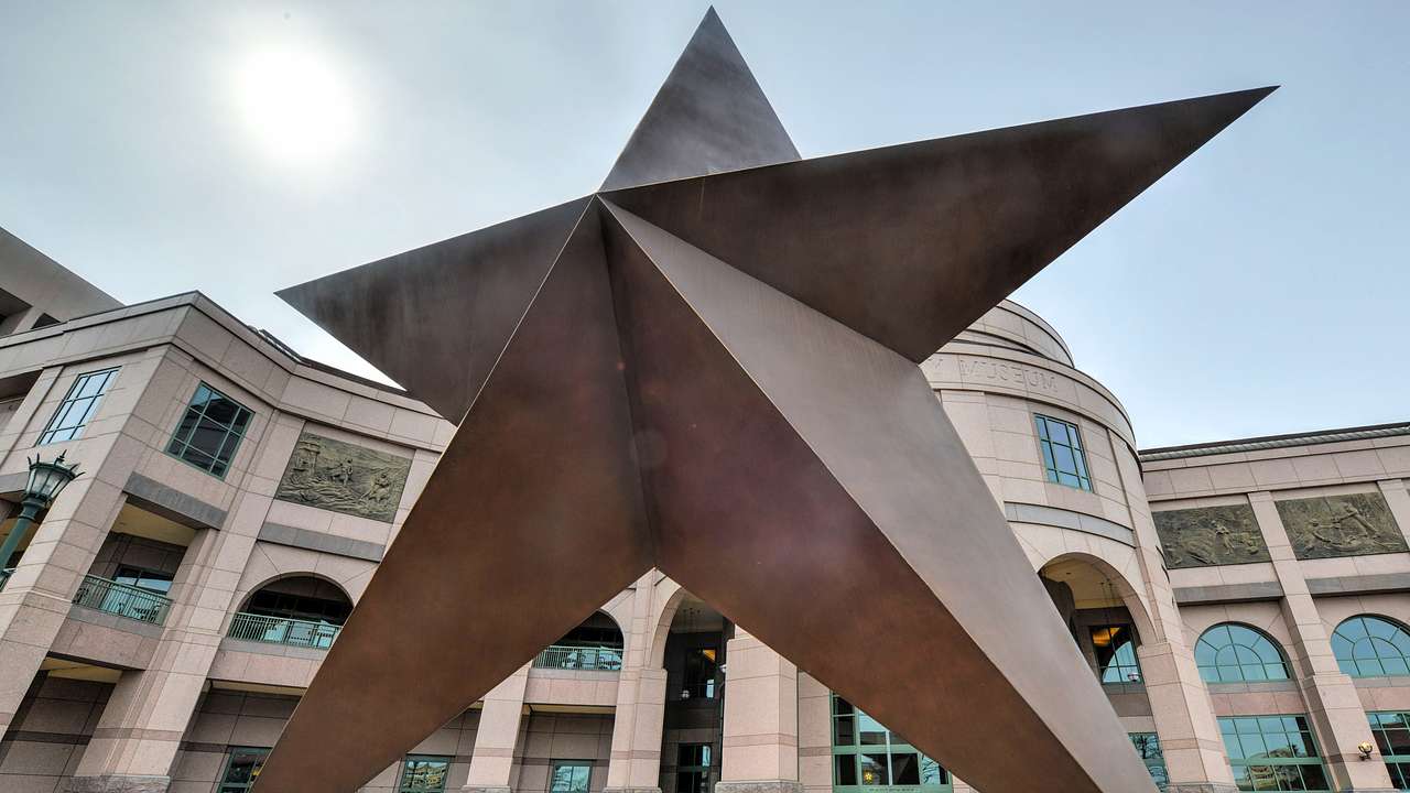 A star-shaped sculpture in front of a building