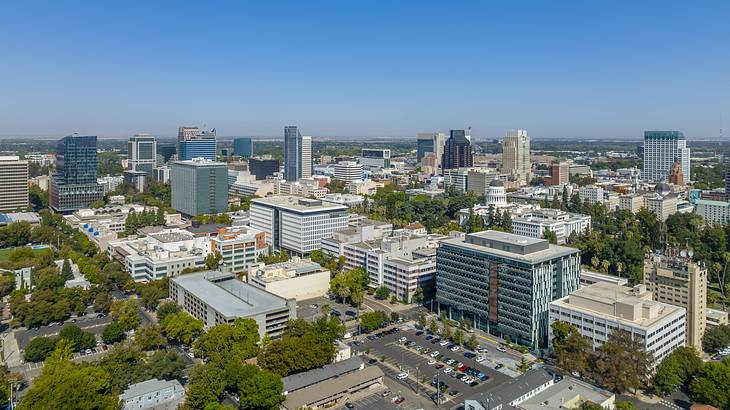 Aerial shot of a city skyline on a bright sunny day