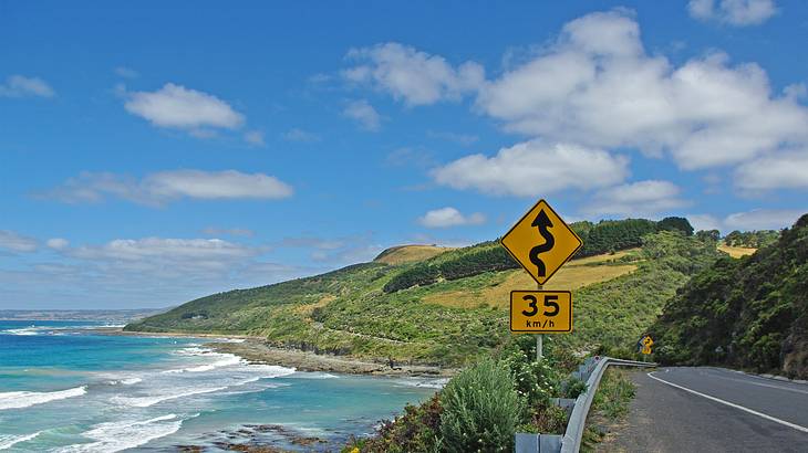 Picture of a road, water and hills, Great Ocean Road, Victoria, Australia