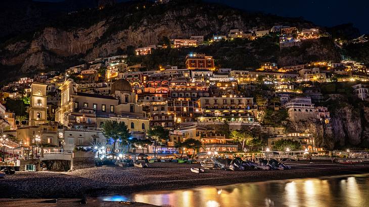 View of buildings on a mountainous island at night