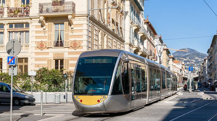 A tram surrounded by old buildings