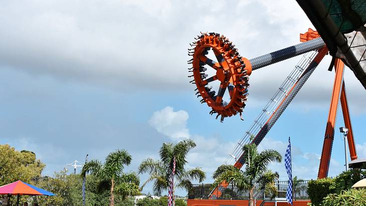 A spinning mechanized theme park thrill ride