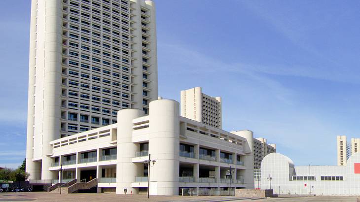 A white tall building under a clear blue sky