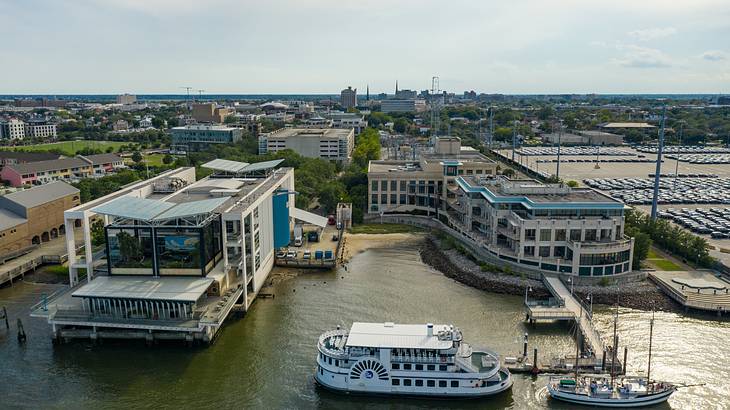 Aerial view of a ferry and a boat on the harbor of a coastal city