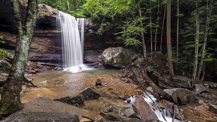 A waterfall flowing into a rocky pool