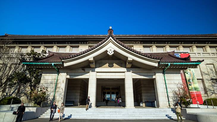 Museum's facade with stairs and clear blue sky above