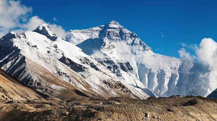 Up-close snow covered mountain tops with jagged terrain