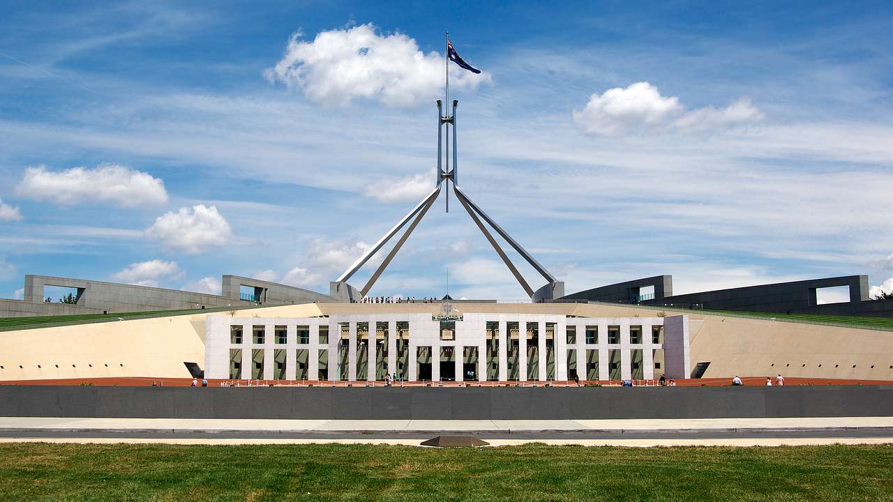 Parliament House behind a big green field, Canberra, Australia