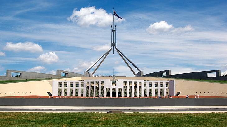 Parliament House behind a big green field, Canberra, Australia
