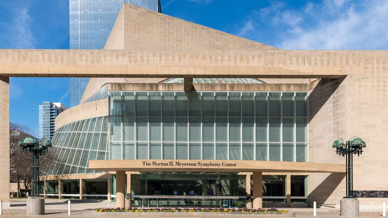 A building with glass panels and a "Morton H. Meyerson Symphony Center" sign