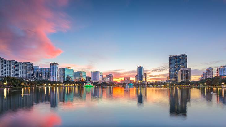 Beautiful skyline reflection on Lake Eola during sunset