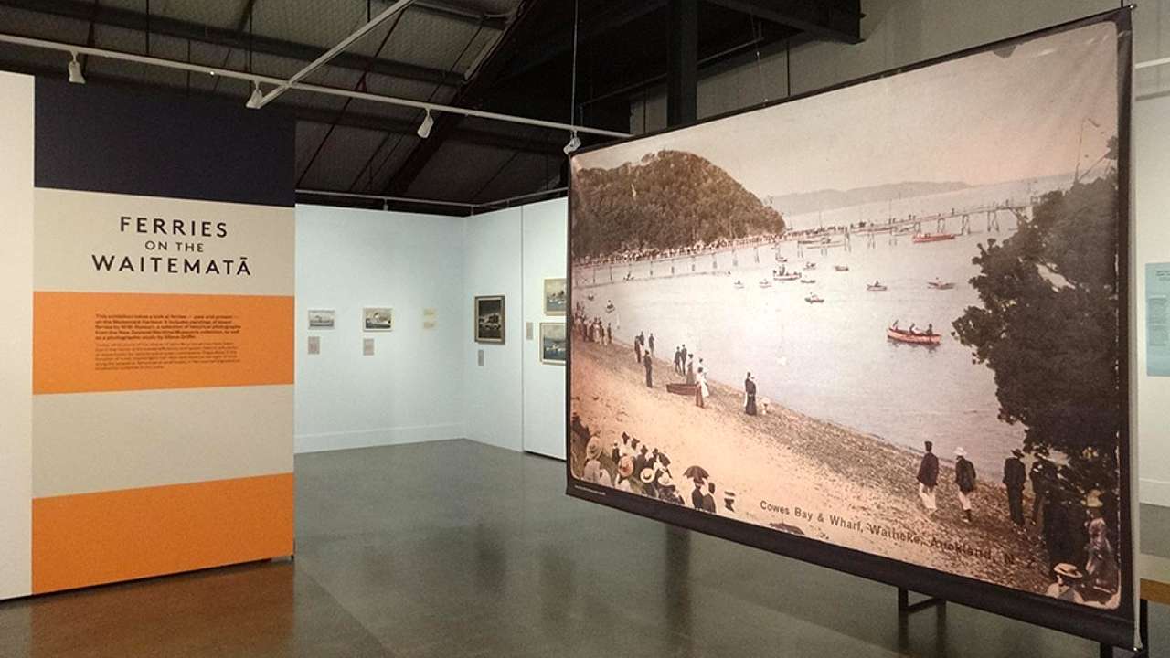 Gallery walls and a picture of water with boats on it