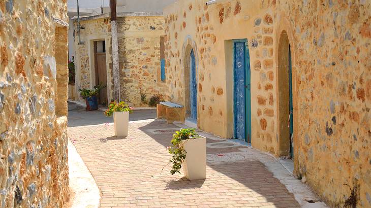 A cobblestone street surrounded by old stone houses