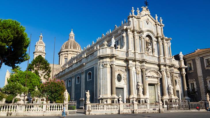 A church building with Norman-Baroque architecture under a clear blue sky