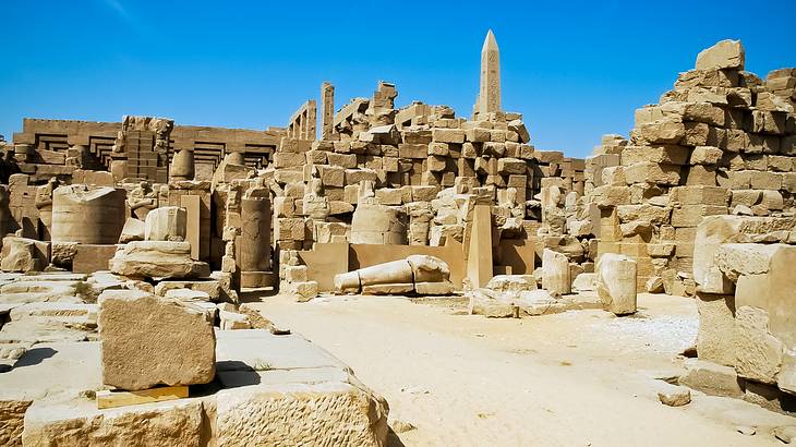 Ancient ruins of Egyptian buildings in a desert in Luxor