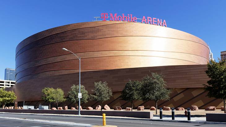 A sphere-shaped modern building with a sign saying "T Mobile Arena"
