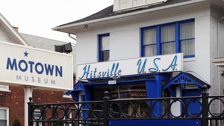 A white and blue house with signs saying "Motown Museum" and "Hitsville USA"