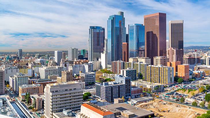 Aerial shot of a city with skyscrapers and buildings on a sunny day