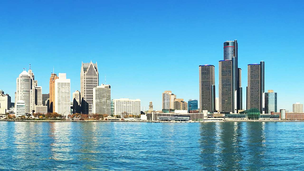 Skyscrapers near a body of water on a bright day