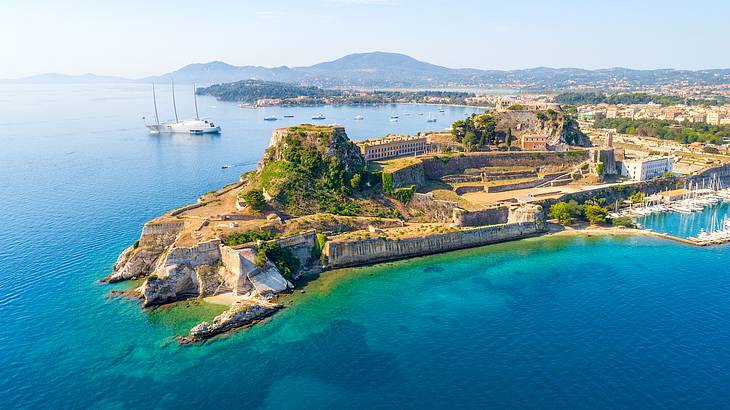 An old fortress on top of Corfu Island surrounded by blue sea, in Greece